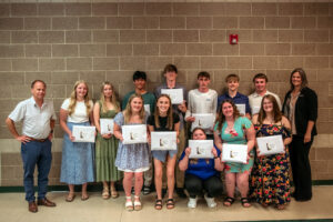Students from Deer River High School received their Blandin Foundation Scholarship awards during the school’s spring awards ceremony. Blandin Foundation trustee Sholom Blake (far left) and Jen Alger (far right), the foundation’s scholarship program manager, presented the awards.